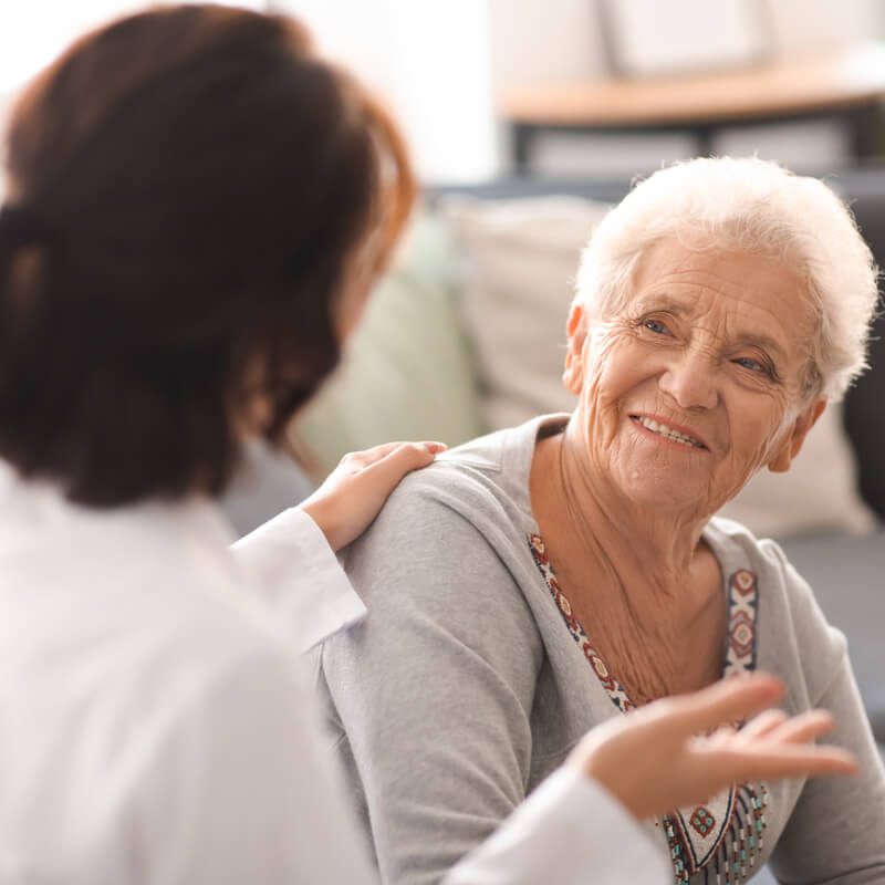 An elderly woman getting speech therapy in recuperative care.