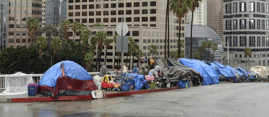 Homeless encampment on Los Angeles County sidewalk.