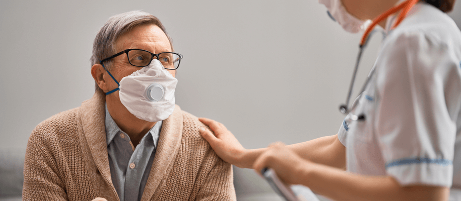 A man and a staff at a recuperative care facility.