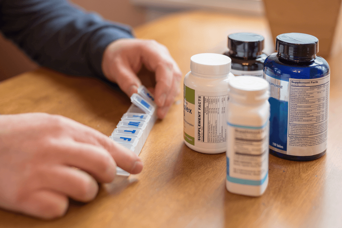 A man in rehabilitative care manages his medication.